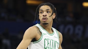 Nov 7, 2025; Orlando, Florida, USA; Boston Celtics forward Josh Minott (8) reacts after  play against the Orlando Magic in the first quarter at Kia Center. Mandatory Credit: Nathan Ray Seebeck-Imagn Images