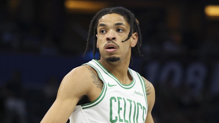 Nov 7, 2025; Orlando, Florida, USA; Boston Celtics forward Josh Minott (8) reacts after  play against the Orlando Magic in the first quarter at Kia Center. Mandatory Credit: Nathan Ray Seebeck-Imagn Images