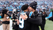 Nov 30, 2025; Charlotte, North Carolina, USA; Carolina Panthers head coach Dave Canales celebrates with Carolina Panthers quarterback Bryce Young (9) after the game against the Los Angeles Rams at Bank of America Stadium.