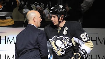 Feb 11, 2015; Pittsburgh, PA, USA; NBC network hockey analyst Pierre McGuire (left) shakes hand with Pittsburgh Penguins center Sidney Crosby (87) after the Penguins defeated the Detroit Red Wings at the CONSOL Energy Center. The Penguins won 4-1. Mandatory Credit: Charles LeClaire-Imagn Images