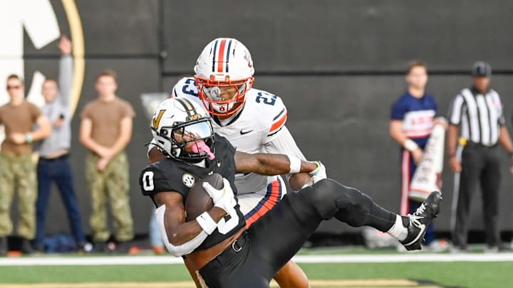Vanderbilt wide receiver Junior Sherrill (0) catches a touchdown pass in front of Auburn cornerback Jay Crawford (23) during the second quarter at FirstBank Stadium in Nashville, Tenn., Saturday, Nov. 8, 2025.