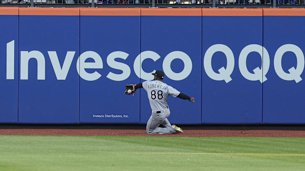 Chicago White Sox center fielder Luis Robert Jr. can not secure a ball hit by Tyrone Taylor at CitiField.