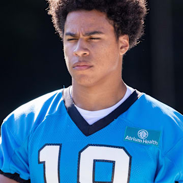 Jul 24, 2025; Charlotte, NC, USA; Carolina Panthers wide receiver Jalen Coker (18) walks out for training camp.