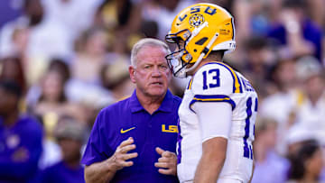 Sep 28, 2024; Baton Rouge, Louisiana, USA;  LSU Tigers quarterback Garrett Nussmeier (13) talks to head coach Brian Kelly during warmups before a game against the South Alabama Jaguars at Tiger Stadium. Mandatory Credit: Stephen Lew-Imagn Images