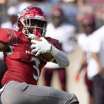 Virginia Union running back Jada Byers breaks the tackle of Morehouse's Cameron Selders as he runs for a first-half touchdown in the Black College Football Hall of Fame Classic, Sunday, Sept. 3, 2023, in Canton.