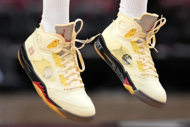 P.J. Tucker wears white and red Air Jordan sneakers.