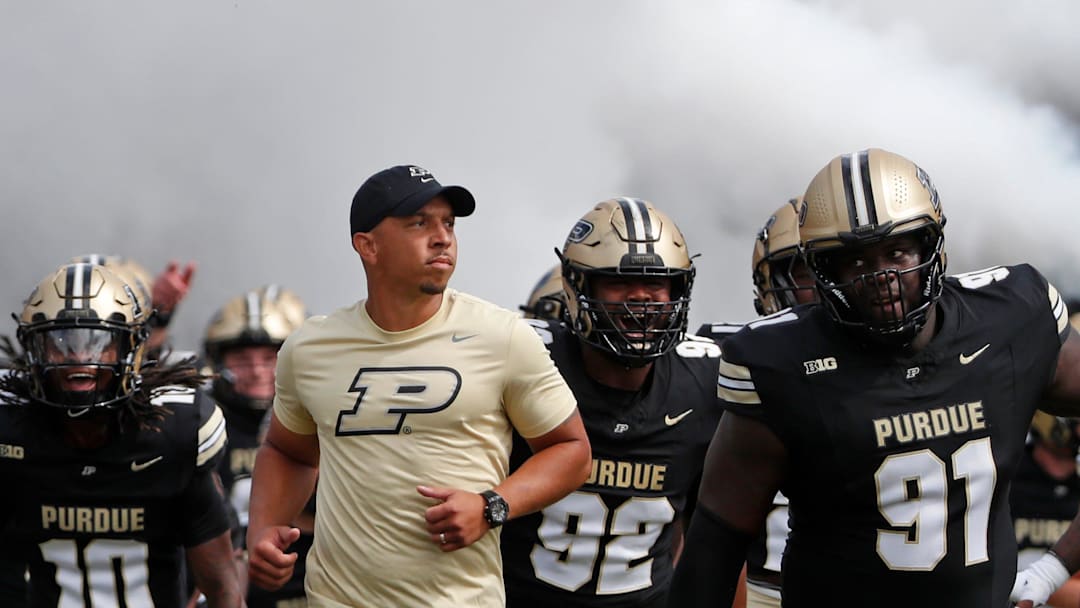 Purdue Boilermakers head coach Ryan Walters leads Purdue onto the field Saturday, Aug. 31, 2024, ahead of the NCAA football game against the Indiana State Sycamores at Ross-Ade Stadium in West Lafayette, Ind. Purdue Boilermakers won 49-0.