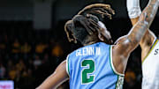 Feb 23, 2025; Wichita, Kansas, USA; Wichita State Shockers forward Corey Washington (6) shoots the ball over Tulane Green Wave forward Gregg Glenn III (2) during the second half at Charles Koch Arena