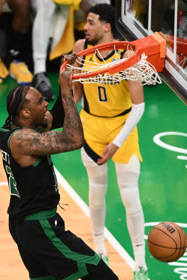 Boston Celtics forward Oshae Brissett (12) dunks the ball during a game against the Indiana Pacers.