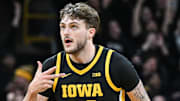 Dec 12, 2024; Iowa City, Iowa, USA; Iowa Hawkeyes forward Owen Freeman (32) reacts after hitting a three-point basket against the Iowa State Cyclones during the first half at Carver-Hawkeye Arena. Mandatory Credit: Jeffrey Becker-Imagn Images