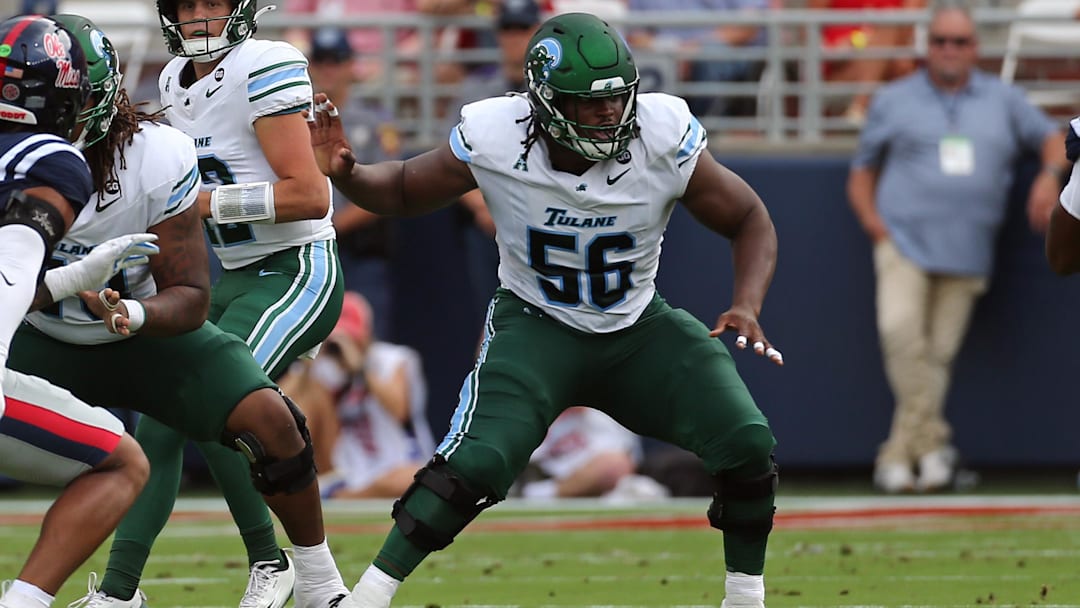 Sep 20, 2025; Oxford, Mississippi, USA; Tulane Green Wave offensive linemen Shadre Hurst (56) blocks during the first quarter against the Mississippi Rebels at Vaught-Hemingway Stadium. Mandatory Credit: Petre Thomas-Imagn Images