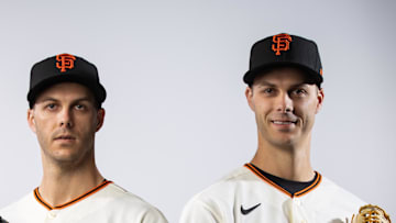 San Francisco Giants pitcher Taylor Rogers (left) and identical twin brother Tyler Rogers pose for a portrait together during photo day at Scottsdale Stadium in 2023. 