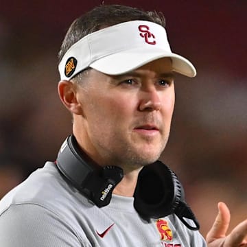 Oct 1, 2022; Los Angeles, California, USA;  USC Trojans head coach Lincoln Riley applauds after a touchdown in the first half against the Arizona State Sun Devils at United Airlines Field at the Los Angeles Memorial Coliseum. Mandatory Credit: Jayne Kamin-Oncea-Imagn Images