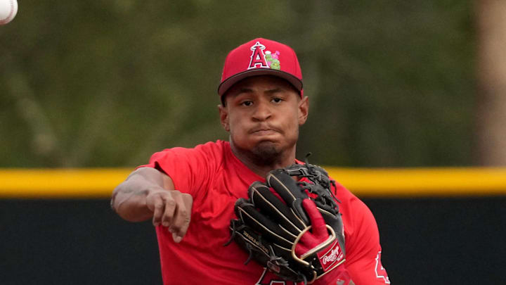Feb 16, 2026; Tempe, AZ, USA; Los Angeles Angels second baseman Christian Moore (4) takes fielding practice during spring training camp. Mandatory Credit: Rick Scuteri-Imagn Images