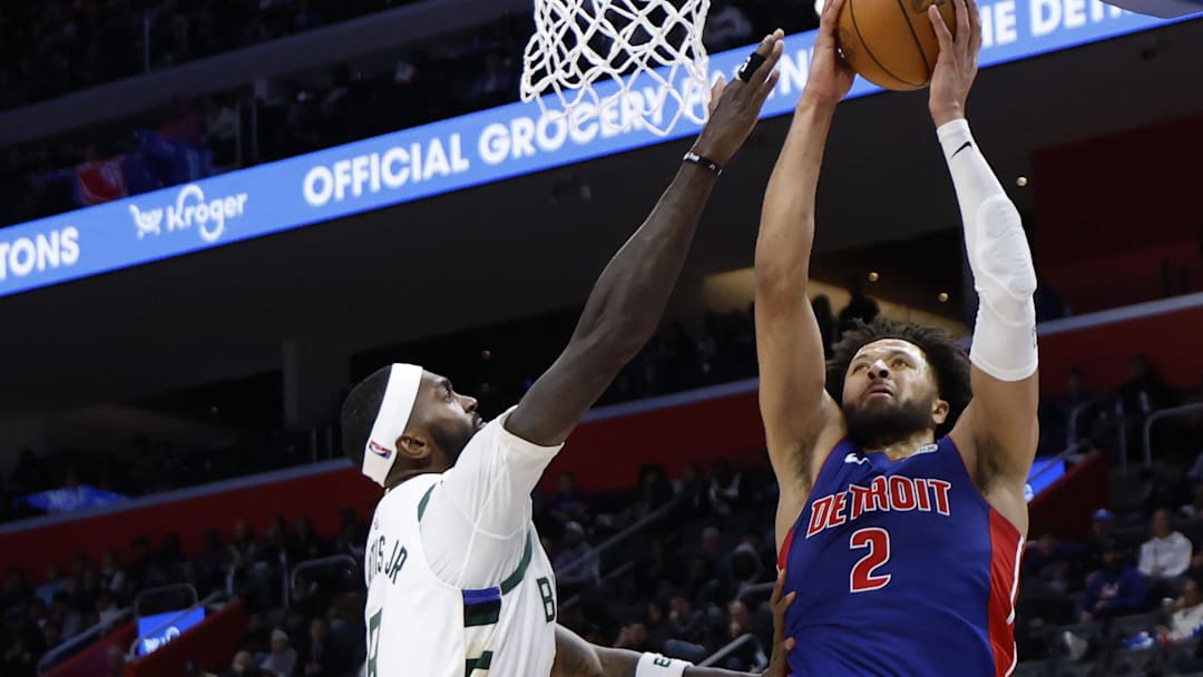Dec 6, 2025; Detroit, Michigan, USA;  Detroit Pistons guard Cade Cunningham (2) shoots on Milwaukee Bucks center Myles Turner (3) in the second half at Little Caesars Arena. Mandatory Credit: Rick Osentoski-Imagn Images