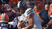Purdue Boilermakers quarterback Ryan Browne (15) runs with the ball 