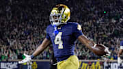 Notre Dame Fighting Irish running back Jeremiyah Love (4) celebrates a touchdown against the Southern California Trojans at Notre Dame Stadium. 