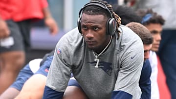 New England Patriots quarterback Joe Milton III (19) warms up before a game against the Carolina Panthers at Gillette Stadium.
