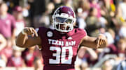 Nov 22, 2025; College Station, Texas, USA; Texas A&M Aggies defensive end Solomon Williams (30) celebrates after a tackle in the second half of a game agains the Samford Bulldogs at Kyle Field. Mandatory Credit: Joseph Buvid-Imagn Images