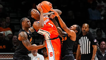 Tennessee guard Darlinstone Dubar (8) and Tennessee guard Zakai Zeigler (5) defend Syracuse forward Donnie Freeman (1) during a college basketball game between Tennessee and Syracuse held at Thompson-Boling Arena at Food City Center in Knoxville, Tenn., on Tuesday, Dec. 3, 2024.