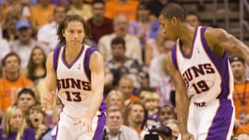 May 2, 2006; Phoenix, AZ, USA; Phoenix Suns player Raja Bell (19) fouls Los Angeles Lakers player Kobe Bryant in the 4th quarter of game 5 in the first round of the NBA playoffs at US Airways Center. Mandatory Credit: Michael Chow/The Arizona Republic via USA TODAY NETWORK