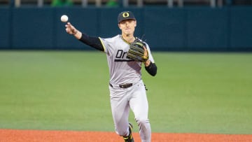Oregon's Maddox Molony (9) throws the ball to first base during the NCAA college baseball game at Goss Stadium on Friday, April 26, 2024, in Corvallis, Ore.