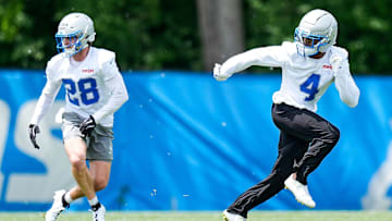 Detroit Lions cornerback D.J. Reed (4), right, and safety Dan Jackson (28) practices during OTA at Meijer Performance Center in Allen Park on Friday, May 30, 2025.