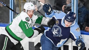 Texas Stars left wing Curtis McKenzie (16) and Milwaukee Admirals center Juuso Parssinen (13) crash into the glass during the second period of their game Saturday, February 10, 2024, at the UW-Milwaukee Panther Arena in Milwaukee, Wisconsin.