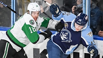 Texas Stars left wing Curtis McKenzie (16) and Milwaukee Admirals center Juuso Parssinen (13) crash into the glass during the second period of their game Saturday, February 10, 2024, at the UW-Milwaukee Panther Arena in Milwaukee, Wisconsin.