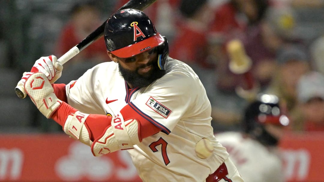 Jul 30, 2024; Anaheim, California, USA; Los Angeles Angels right fielder Jo Adell (7) is hit by a pitch in the eighth inning against the Colorado Rockies at Angel Stadium. Mandatory Credit: Jayne Kamin-Oncea-USA TODAY Sports