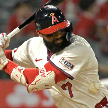 Jul 30, 2024; Anaheim, California, USA; Los Angeles Angels right fielder Jo Adell (7) is hit by a pitch in the eighth inning against the Colorado Rockies at Angel Stadium. Mandatory Credit: Jayne Kamin-Oncea-USA TODAY Sports