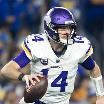 Jan 13, 2025; Glendale, AZ, USA; Minnesota Vikings quarterback Sam Darnold (14) against the Los Angeles Rams during an NFC wild card game at State Farm Stadium. Mandatory Credit: Mark J. Rebilas-Imagn Images