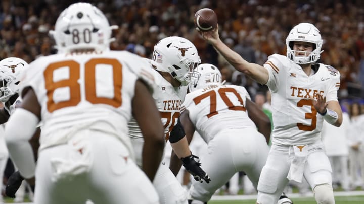 Jan 1, 2024; New Orleans, LA, USA; Texas Longhorns quarterback Quinn Ewers (3) passes the ball to Longhorns offensive lineman Malik Agbo (80) against the Washington Huskies in the 2024 Sugar Bowl college football playoff semifinal game at Caesars Superdome. Mandatory Credit: Geoff Burke-USA TODAY Sports