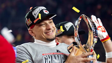Jan 26, 2025; Kansas City, MO, USA; Kansas City Chiefs quarterback Patrick Mahomes celebrates with the Lamar Hunt Trophy after defeating the Buffalo Bills during the AFC Championship game at GEHA Field at Arrowhead Stadium. Mandatory Credit: Mark J. Rebilas-Imagn Images