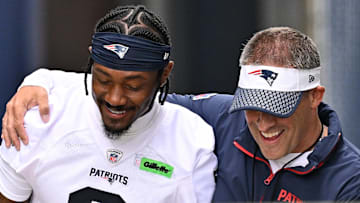 Jun 9, 2025; Foxborough, MA, USA; New England Patriots offensive coordinator Josh McDaniels (r) walks to the practice field with his arm around wide receiver Stefon Diggs (8) before  minicamp at Gillette Stadium. Mandatory Credit: Eric Canha-Imagn Images