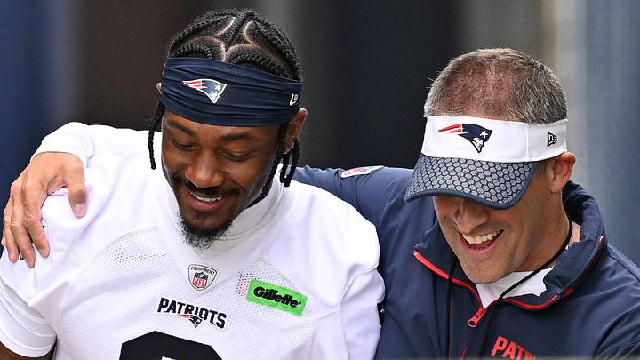 Jun 9, 2025; Foxborough, MA, USA; New England Patriots offensive coordinator Josh McDaniels (r) walks to the practice field with his arm around wide receiver Stefon Diggs (8) before  minicamp at Gillette Stadium. Mandatory Credit: Eric Canha-Imagn Images