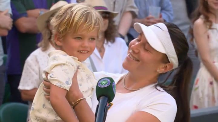 Amanda Anisimova and her nephew celebrate a Wimbledon quarterfinal victory.