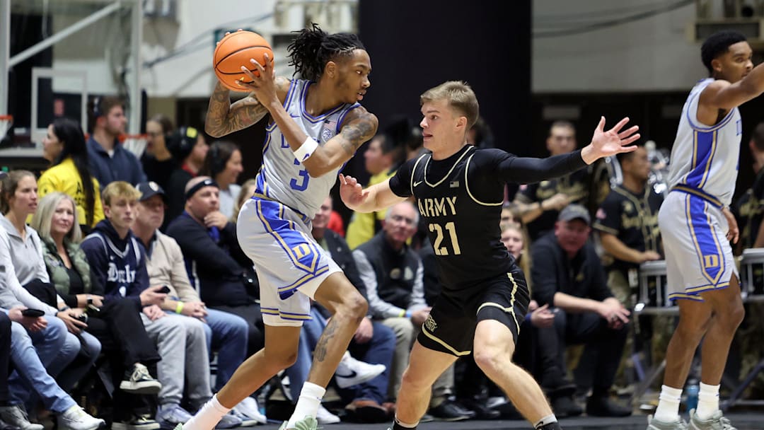 Nov 11, 2025; West Point, New York, USA; Duke basketball guard/forward Isaiah Evans (3) is defended by Army Black Knights guard Jackson Mayo (21) during the first half at Christl Arena. 