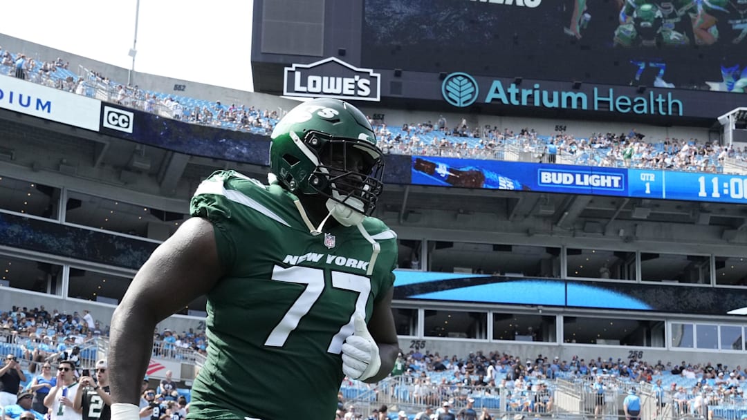 Aug 12, 2023; Charlotte, North Carolina, USA;  New York Jets offensive tackle Mekhi Becton (77) runs