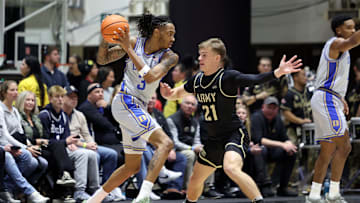 Nov 11, 2025; West Point, New York, USA; Duke basketball guard/forward Isaiah Evans (3) is defended by Army Black Knights guard Jackson Mayo (21) during the first half at Christl Arena. 