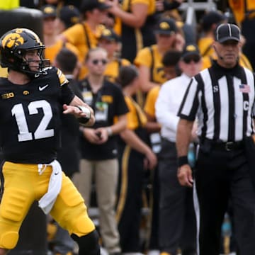 Iowa’s Cade McNamara (12) throws a pass against Troy Saturday, Sept. 14, 2024 at Kinnick Stadium in Iowa City, Iowa.