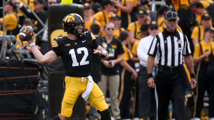 Iowa’s Cade McNamara (12) throws a pass against Troy Saturday, Sept. 14, 2024 at Kinnick Stadium in Iowa City, Iowa.