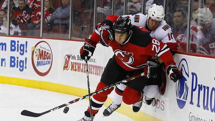 Jan 4, 2008; Newark, NJ, USA; Ottawa Senators right wing Shean Donovan (10) hits New Jersey Devils defenseman Jay Leach (28) during the first period at the Prudential Center. Mandatory Credit: Ed Mulholland-Imagn Images