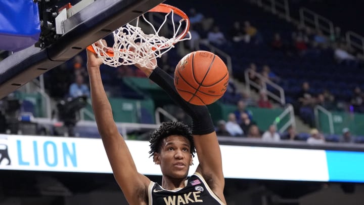 Mar 8, 2023; Greensboro, NC, USA; Wake Forest Demon Deacons forward Bobi Klintman (34) scores in the first half of the second round at Greensboro Coliseum. Mandatory Credit: Bob Donnan-USA TODAY Sports