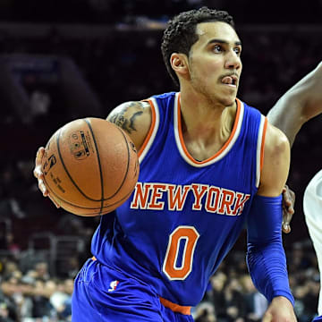 New York Knicks guard Shane Larkin moves toward the net as Philadelphia 76ers forward Luc Richard Mbah a Moute.