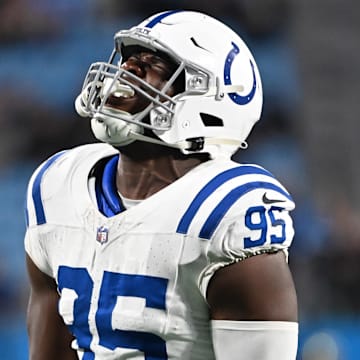 Nov 5, 2023; Charlotte, North Carolina, USA; Indianapolis Colts defensive end Adetomiwa Adebawore (95) reacts after a sack in the fourth quarter at Bank of America Stadium. Mandatory Credit: Bob Donnan-Imagn Images