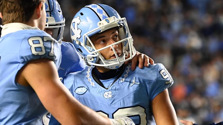 Nov 11, 2023; Chapel Hill, North Carolina, USA; North Carolina Tar Heels place kicker Noah Burnette (98) after kicking the game tying field goal in the fourth quarter at Kenan Memorial Stadium. Mandatory Credit: Bob Donnan-Imagn Images