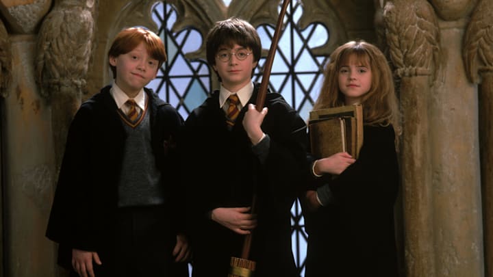 Ron Weasley (Rupert Grint), Harry Potter (Daniel Radcliffe), and Hermione Granger (Emma Watson) in Harry Potter and the Sorcerer's Stone. Courtesy of Fathom Entertainment. 