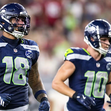 Sep 25, 2025; Glendale, Arizona, USA; Seattle Seahawks tight end Elijah Arroyo (18) and wide receiver Cooper Kupp (10) against the Arizona Cardinals at State Farm Stadium. 