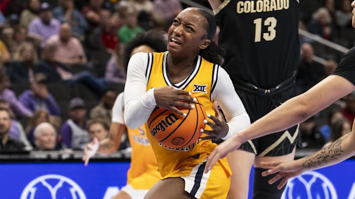 Mar 7, 2026; Kansas City, MO, USA;  West Virginia Mountaineers guard Jordan Harrison (10) drives the ball through the Colorado Buffaloes defense during the second half at T-Mobile Center. Mandatory Credit: Nick Tre. Smith-Imagn Images
